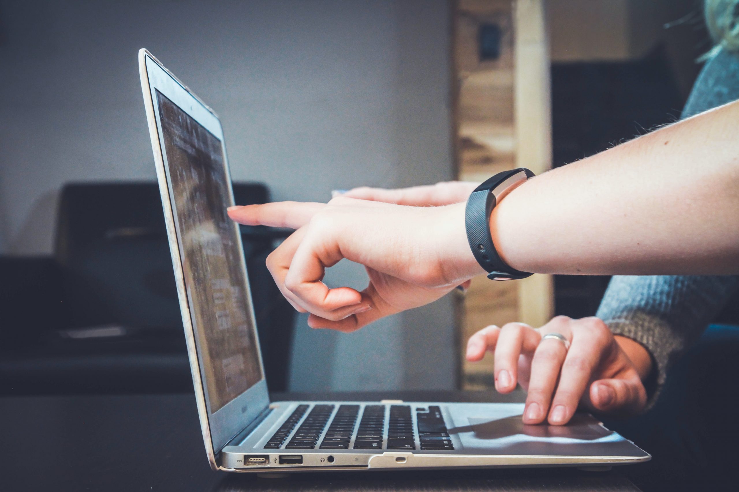 Two people working on a computer