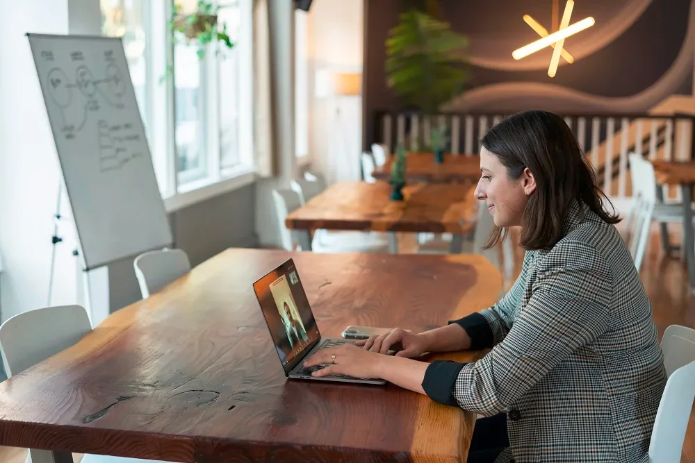 a girl looking at her laptop